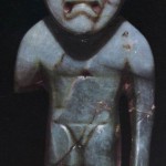Stehende Figur aus Jade. Der Kopf läßt die für die Träger der La Venta-Kultur typische Schädeldeformatic erkennen. Fundort: Ocozocoautl, Chiapas. La Venta-Kultur. Etwa 500 v. d. Z. - 200 n. d. Z. Höhe: 7,5 cm. Museo Regional, Tuxtla Gutierrez, Chiapas.